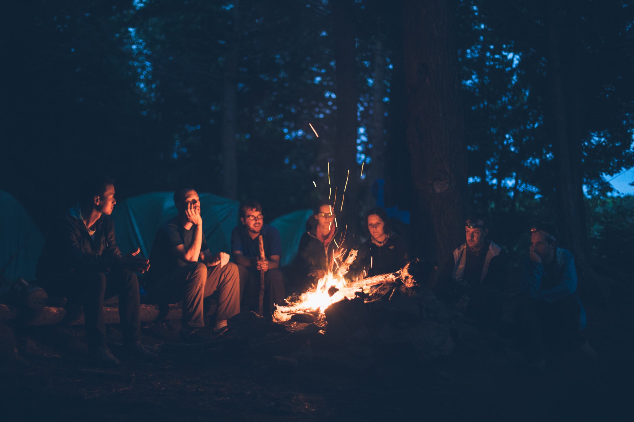 Sitting around a camp fire is a great way to recharge your mental health in Fort Collins